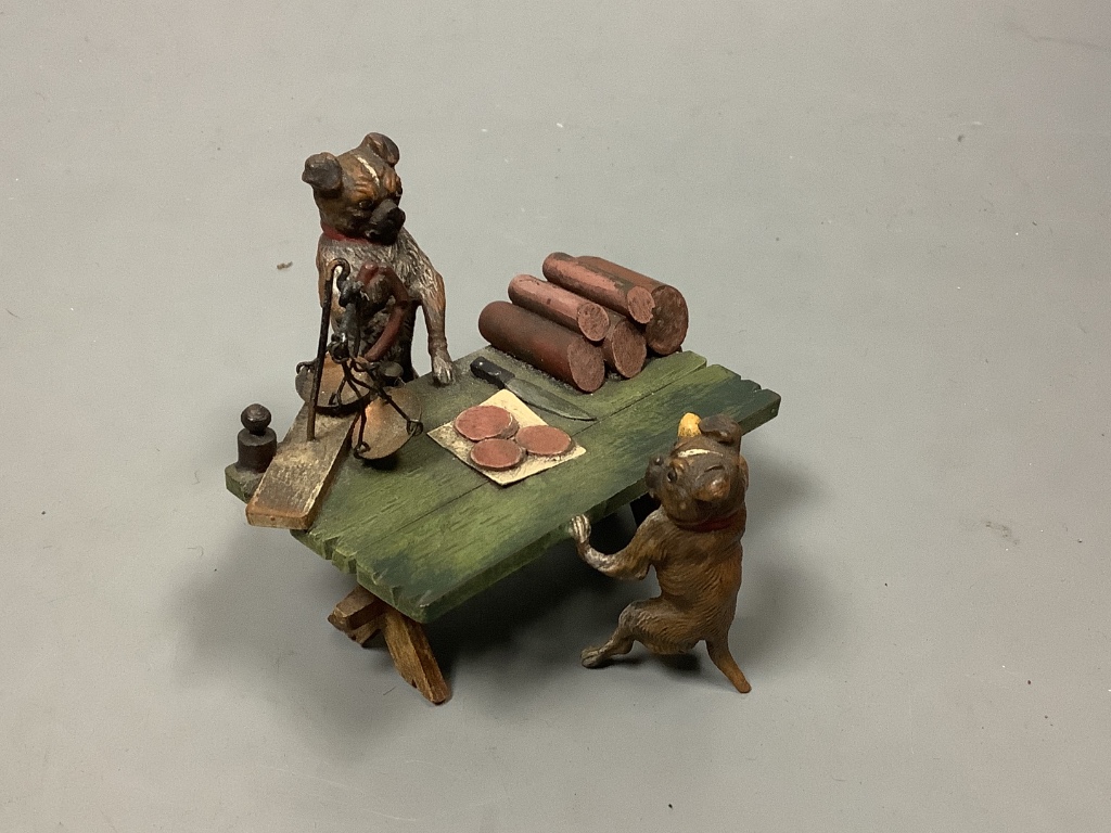 A cold painted bronze group of a ‘butcher dog’ and their client. marked Austria Geschutz, length 7cm 7cm